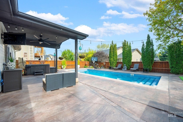 view of pool with a fenced backyard, a hot tub, a patio, and ceiling fan