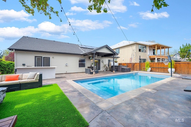 view of pool featuring a fenced backyard, outdoor lounge area, a fenced in pool, and a patio