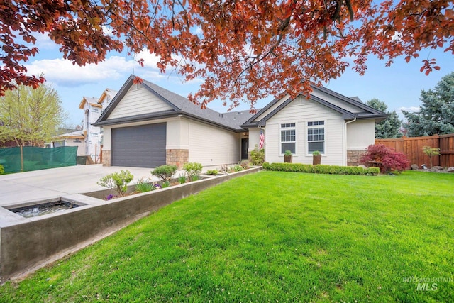 single story home with a front lawn, fence, stone siding, and driveway