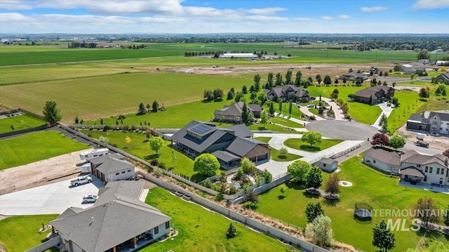 birds eye view of property with a rural view and a residential view