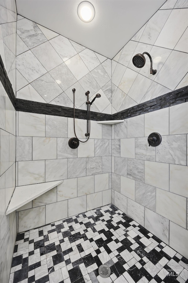 bathroom with a tile shower