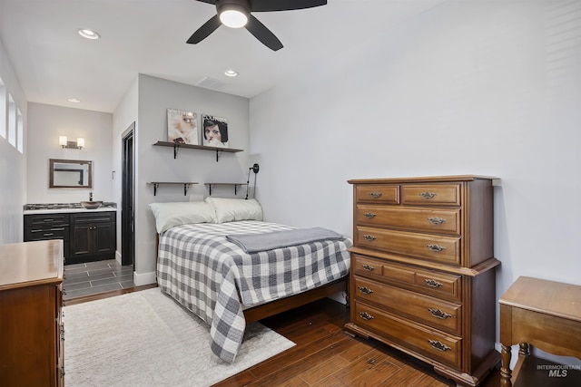 bedroom featuring visible vents, ensuite bathroom, a ceiling fan, recessed lighting, and dark wood-style flooring