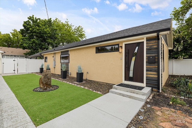 2402 Columbus, Boise, ID 83705 - entrance to property with a gate and stucco siding