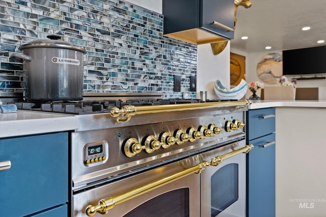 2402 Columbus, Boise, ID 83705 - kitchen view of blue cabinetry, tasteful backsplash, recessed lighting, and double oven range