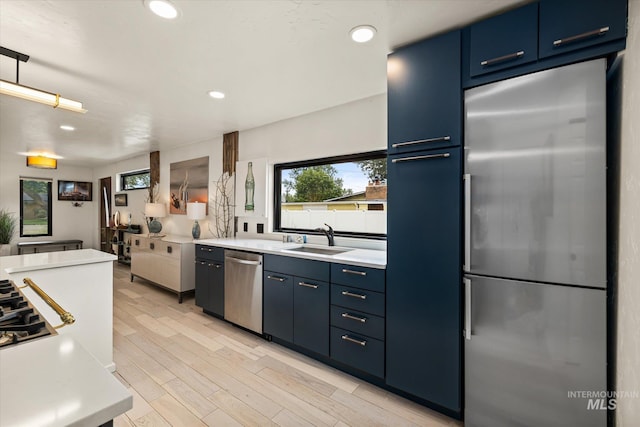2402 Columbus, Boise, ID 83705 - kitchen with appliances with stainless steel finishes, a sink, blue cabinetry, light countertops, and recessed lighting