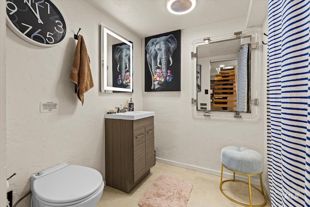 2402 Columbus, Boise, ID 83705 - bathroom with vanity, toilet, and baseboards