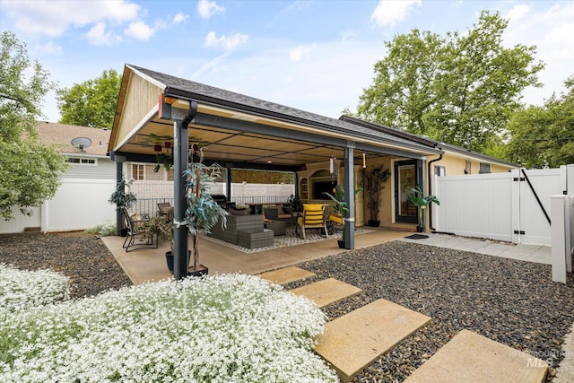 2402 Columbus, Boise, ID 83705 - fenced backyard featuring an outdoor hangout area, a patio area, and a gate
