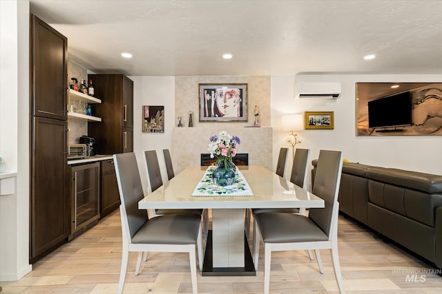 2402 Columbus, Boise, ID 83705 - dining room featuring wine cooler, a wall mounted air conditioner, light wood finished floors, and recessed lighting