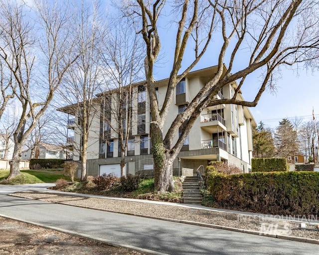 view of property featuring stairs