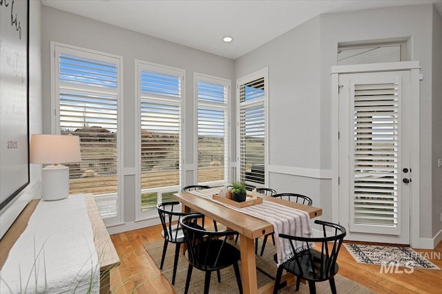 dining area featuring light wood-style flooring and recessed lighting