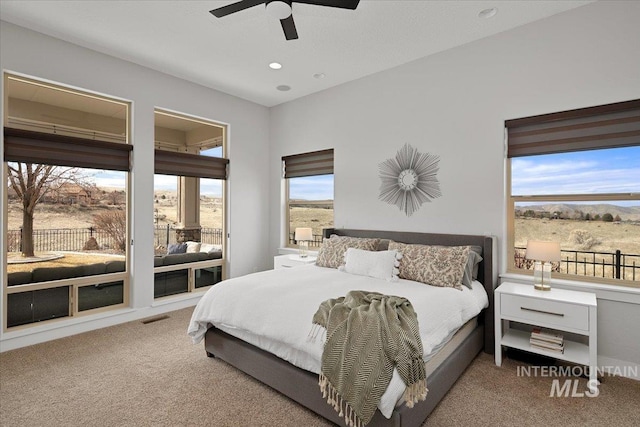 carpeted bedroom with access to exterior, visible vents, a ceiling fan, and recessed lighting