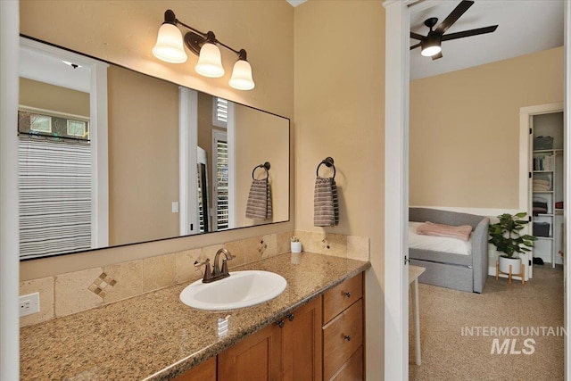 bathroom with a ceiling fan and vanity