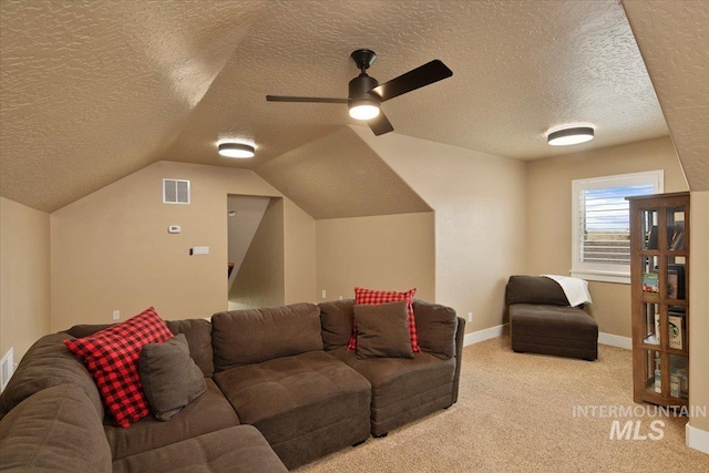 living area featuring baseboards, visible vents, light colored carpet, lofted ceiling, and ceiling fan