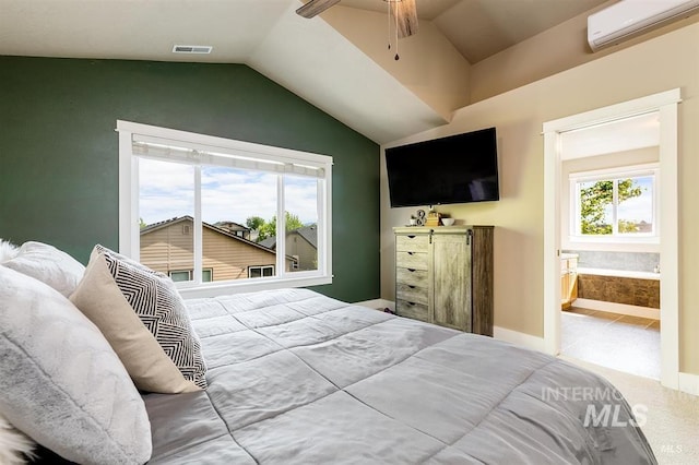 bedroom featuring visible vents, carpet flooring, lofted ceiling, and a wall unit AC