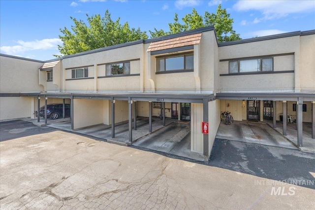 1134 N Camelot Dr, Boise, ID 83704 - view of front of property with stucco siding and covered parking