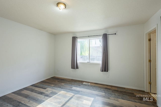 4709 Pioneer Ave, Caldwell, ID 83607 - spare room with wood finished floors and baseboards