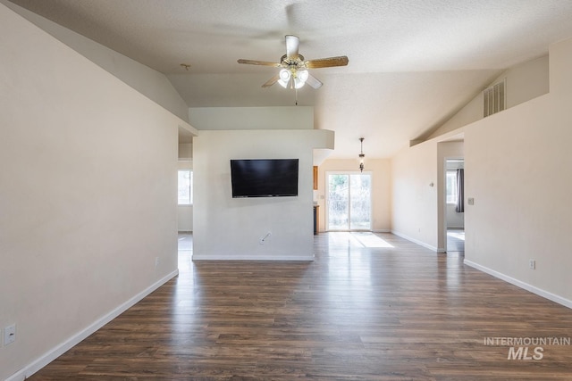 4709 Pioneer Ave, Caldwell, ID 83607 - unfurnished living room with lofted ceiling, ceiling fan, dark wood-style floors, and baseboards