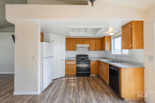 4709 Pioneer Ave, Caldwell, ID 83607 - kitchen with black appliances, under cabinet range hood, a sink, and dark wood-style floors