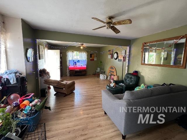 1495 W 7th, Weiser, ID 83672 - living room featuring a ceiling fan and light wood finished floors