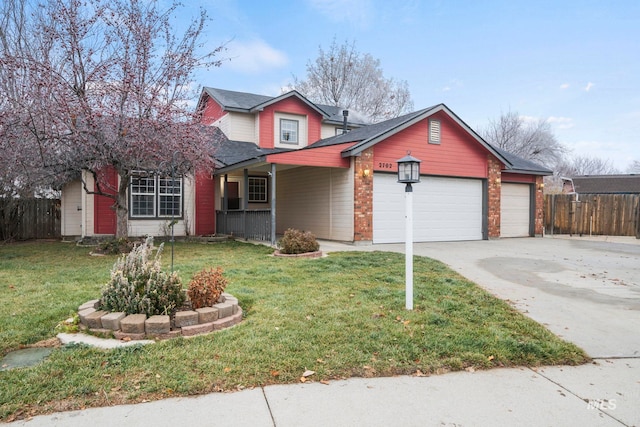 front of property with a garage and a front lawn