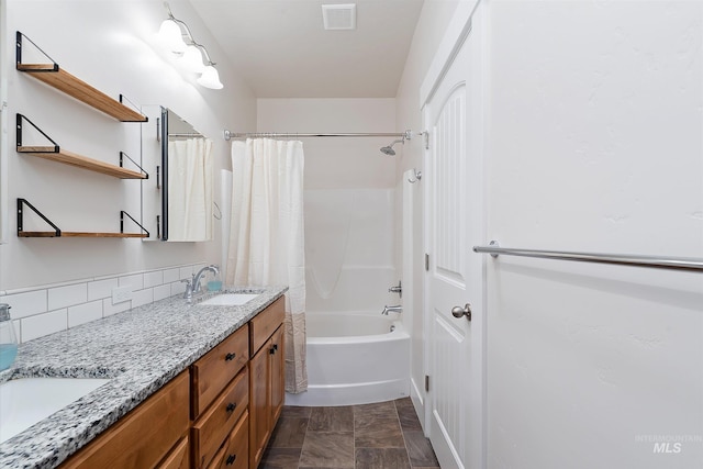 full bathroom featuring shower / tub combo with curtain, a sink, visible vents, and double vanity