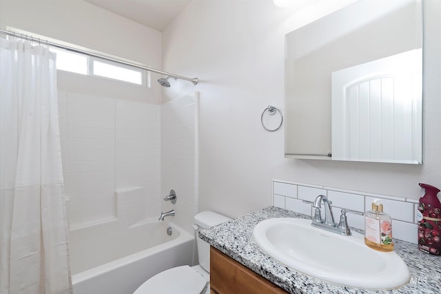 full bathroom featuring shower / bath combination with curtain, vanity, tasteful backsplash, and toilet