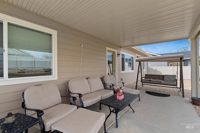 view of patio / terrace with fence and an outdoor hangout area