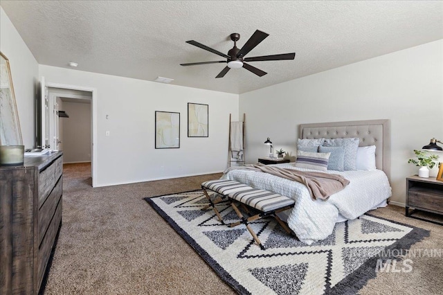 bedroom with baseboards, a textured ceiling, a ceiling fan, and carpet floors