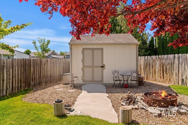 3012 Myrtlewood Way, Nampa, ID 83686 - view of shed featuring an outdoor fire pit and a fenced backyard