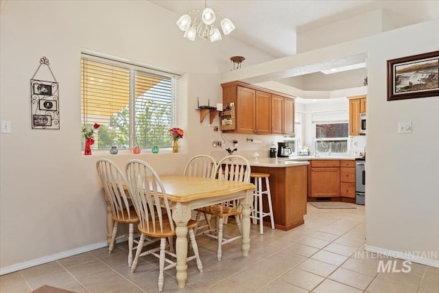 3012 Myrtlewood Way, Nampa, ID 83686 - dining space featuring plenty of natural light, light tile patterned floors, and a chandelier