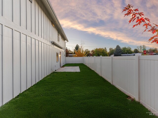 view of yard with a fenced backyard and a patio area