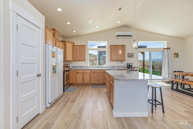 8142 US Highway 95, Marsing, ID 83639 - kitchen with white fridge with ice dispenser, lofted ceiling, a center island, a wall mounted air conditioner, and light wood-type flooring