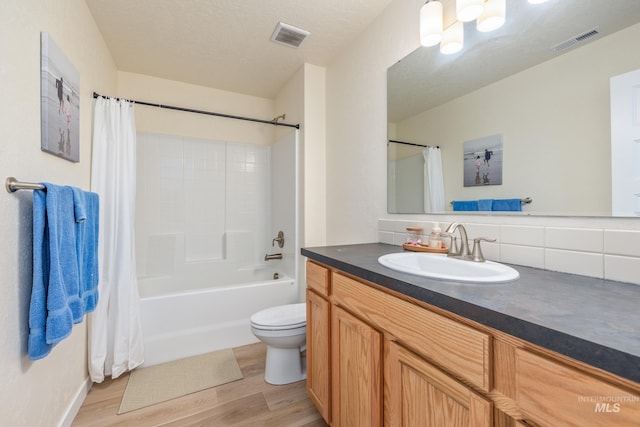 8142 US Highway 95, Marsing, ID 83639 - full bathroom with wood finished floors, vanity, shower / bathtub combination with curtain, and toilet