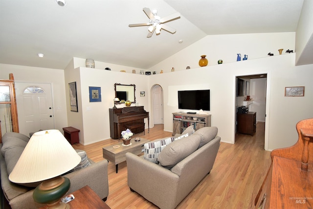 living room featuring high vaulted ceiling, light hardwood / wood-style floors, and ceiling fan