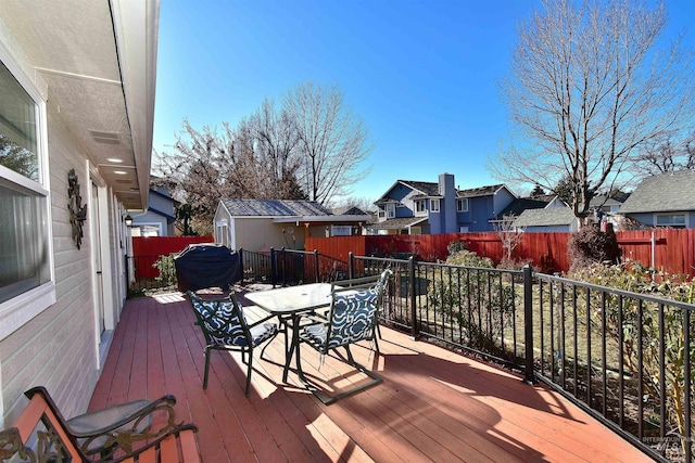 wooden terrace with an outdoor structure