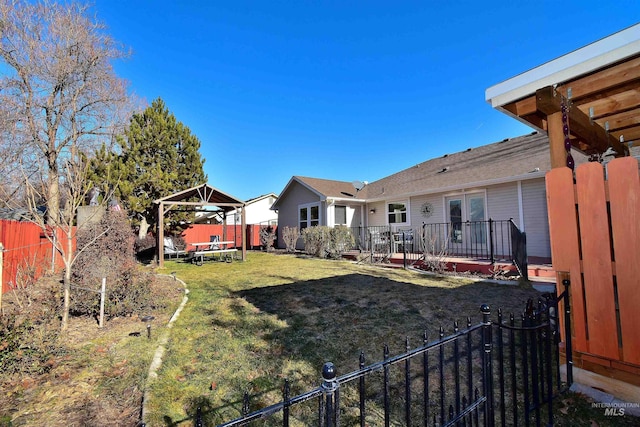 view of yard with a trampoline and a gazebo