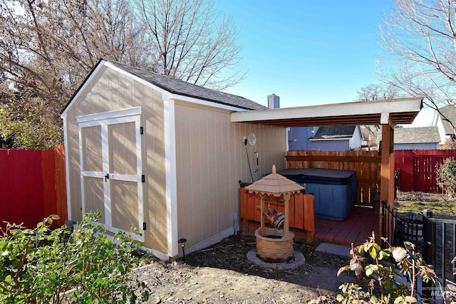 view of outbuilding with central AC and a hot tub