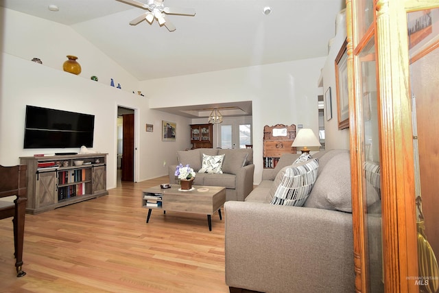 living room featuring french doors, ceiling fan, lofted ceiling, and hardwood / wood-style floors