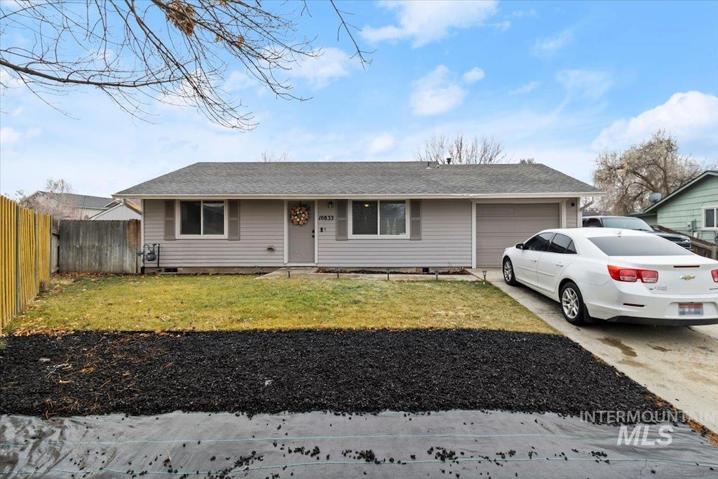 ranch-style house with a front lawn and a garage