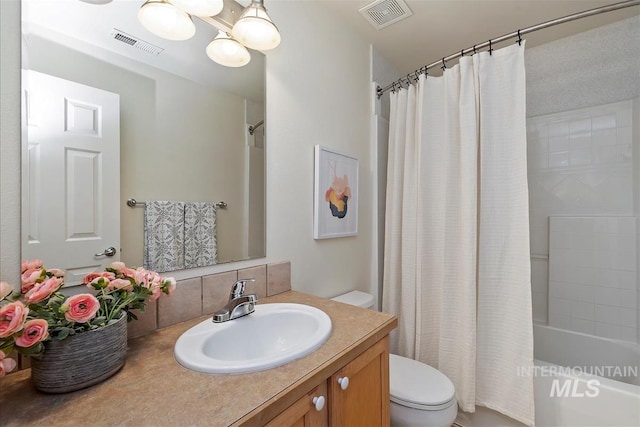 bathroom featuring backsplash, toilet, visible vents, and shower / tub combo
