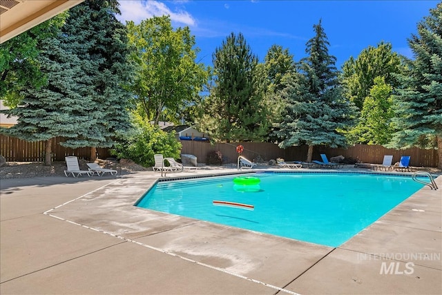 view of pool featuring fence, a patio area, and a fenced in pool