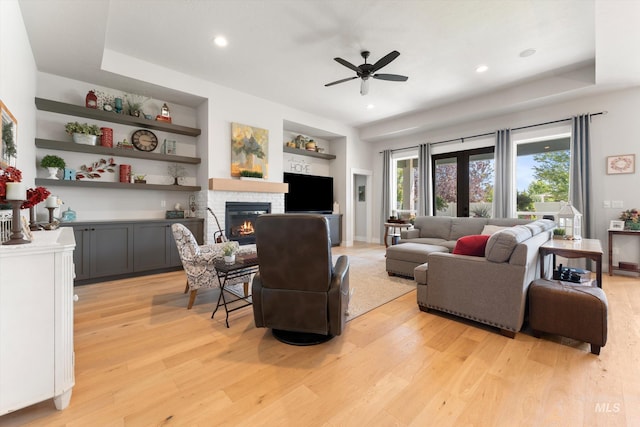 4337 W Ravenna St, Meridian, ID 83646 - living room with light wood-style floors, a fireplace, ceiling fan, built in shelves, and recessed lighting
