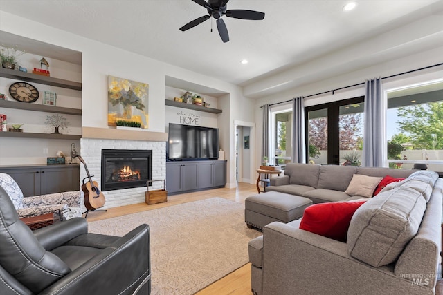 4337 W Ravenna St, Meridian, ID 83646 - living area with a ceiling fan, light wood-style flooring, built in features, a fireplace, and recessed lighting