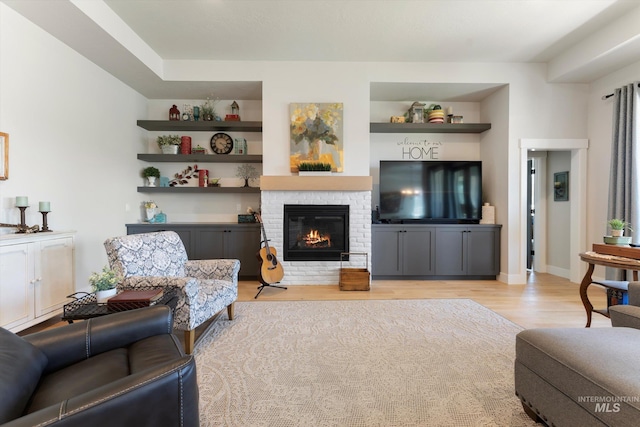 4337 W Ravenna St, Meridian, ID 83646 - living room featuring light wood-style floors and a brick fireplace