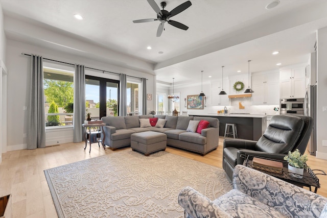 4337 W Ravenna St, Meridian, ID 83646 - living room featuring plenty of natural light, a ceiling fan, recessed lighting, and light wood-style floors