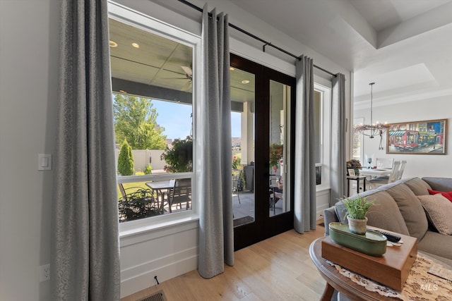 4337 W Ravenna St, Meridian, ID 83646 - foyer with french doors, light wood-style floors, and a chandelier