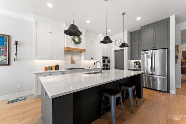 4337 W Ravenna St, Meridian, ID 83646 - kitchen with appliances with stainless steel finishes, light wood finished floors, decorative backsplash, light countertops, and recessed lighting