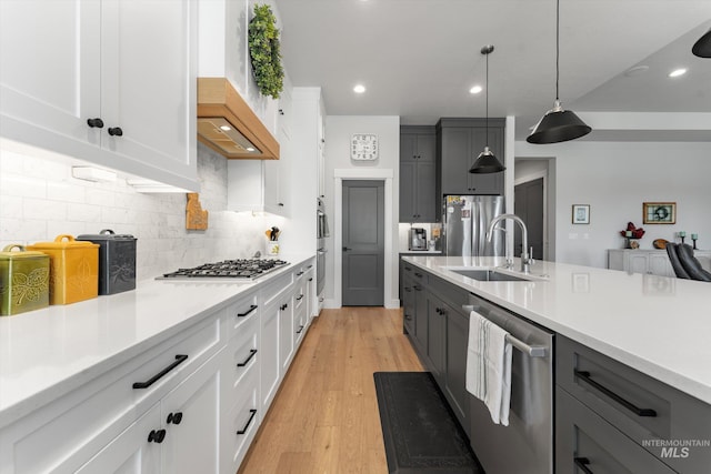 4337 W Ravenna St, Meridian, ID 83646 - kitchen featuring appliances with stainless steel finishes, light countertops, gray cabinetry, backsplash, and recessed lighting