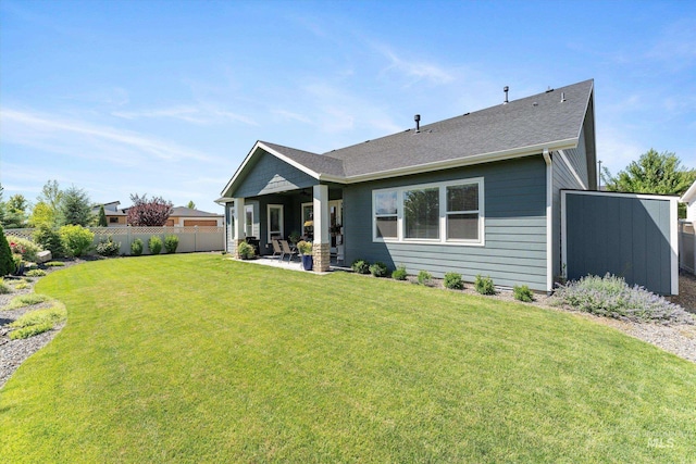 4337 W Ravenna St, Meridian, ID 83646 - back of property featuring a patio and roof with shingles