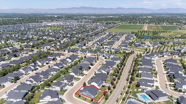 4337 W Ravenna St, Meridian, ID 83646 - aerial perspective of suburban area featuring property parcel outlined and a mountainous background